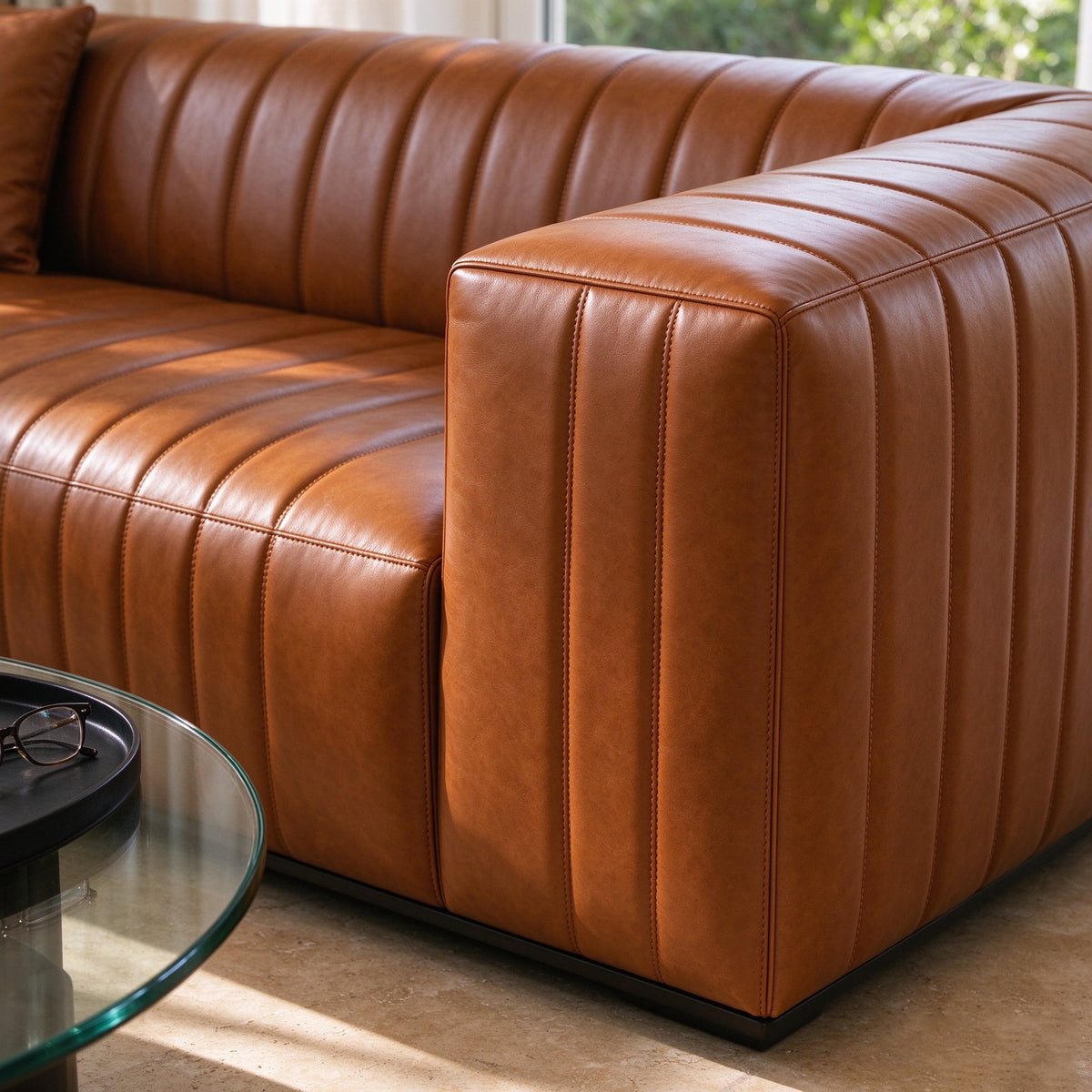 Close-up of the vertical channel tufting running across the sofa arm and seat